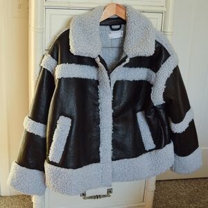 ASOS Design sherpa paneled jacket in black and blue